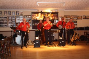 Mike Barry’s XXL Jazz Band at Farnborough Jazz Club, 26th September 2014. MIKE BARRY (trumpet), GOFF DUBBER (reeds), REX O'DELL (trombone), JOHN STUART (banjo & guitar), ROGER CURPHEY (double bass) and PAUL BUDD (drums). Photo by Mike Witt.
