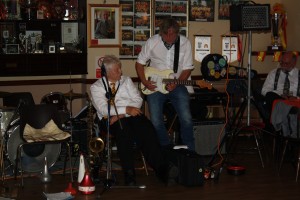 Ronald Andersen takes to electric guitar & Brian Carrick sings 'Muddy Road' both brilliantly - Red Wing Band from Holland on 2014 tour at Farnborough Jazz Club, Kent UK on 31st October. Photo: Mike Witt