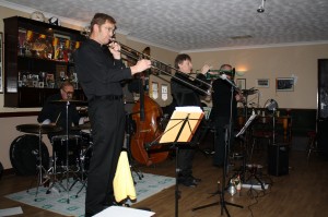 Phoenix Dixieland Jazz Band at Farnborough Jazz Band, Kent, UK on 5th December 2014. (LtoR) Tony Balckburn (drms), Bill Todd (trb) and Paul Hudd (trm).  Photo by Mike Witt.