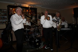 Bob Dwyer's Bix & Pieces at Farnborough Jazz Club on 9th January 2015 with Bob (trombone), Dave Rance [dep](trumpet), Bernie Holden (sax), Hugh Crozier (piano) Laurie Chescoe (drums), John Bayne (d.bass&bass sax) and John Stewart [dep] (banjo&guitar).