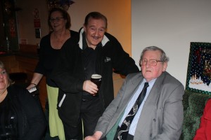 'Comparing Notes'. Denny Islet and Colin Dobson exchange old times. George Tidiman's All Stars at Farnborough Jazz Club 19Dec2014. Photo by Mike Witt.