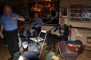George Tidiman with two of his All Stars, Bill Finch (drums) and 'Southend Bob' Albutt (banjo) at Farmborough Jazz Club's Christmas Cracker Party on 19th December 2014. Photo by Mike Witt.