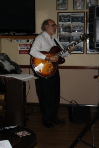 John Stewart (banjo & guitar) depping with Bob Dwyer's Bix & Pieces at Farnborough Jazz Club on 9th January 2015
