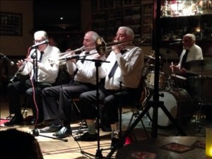 NAPIER HOTSHOTS with (ltoR) PAT GLOVER (reeds), MIKE JACKSON (trmpt), MIKE DUCKWORTH (trmb), plus ARTHUR FRYATT (drms) at Farnborough Jazz Club, 16th January 2015. Photo by Selina McKinven.