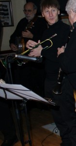 Paul Bud (trmp) and Robin Coombs, leader (&clrt) of Phoenix Dixieland Jazz Band (seen here taking a breather) at Farnborough Jazz Club (Kent) on 22nd January 2015. Photograph by Mike Witt