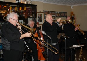 Mike Barry's XXL Jazz Band with Mike (trmp), Rex Odell (trmb) John Elmer (sop.sax), John Stuart (bnjo), Trefor 'Fingers' Williams (d. bass) & Paul Budd (drums) at Farnborough Jazz Club, 13th Feb2015. Photo by Mike Witt.