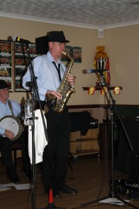 Tim Huskisson plays tenor sax with Barry Palser's Super Six at Farnborough Jazz Club on 27Feb2015. Photo by Mike Witt.