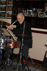 Tiny, drummer of 'Hot Lips' from Munnich, Germany on their 2015 UK Tour, seen here at Farnborough Jazz Club, Kent on 6th March 2015. Photo by Mike Witt.