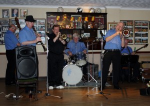 ‘George ‘Kid’ Tidiman’s 'All Stars’ at Farnborough Jazz Club, Kent, UK on Friday 17th April 2015. (LtoR) John Siret (d.bass), Tim Huskisson (clt), Denny Islet (trmp) Bill Finch (drms), George 'Kid' trmb & 'Southend Bob' Albutt (bnj). Photo by Mike Witt