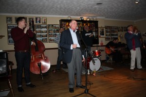Peter Mar stars, singing 'Easter Parade' with Martyn Brothers. Ben & Emile Martyn (d.bass & drums), Alan Beechey (trumpet), Jeff Williams (trombone), Adrian Cox (clarinet), & JOHN ‘flashback radio’ RUSCOE (guitar) at Farnborough Jazz Club, Kent on 3rd April 2015. Photo by Mike Witt.