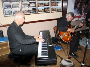 Laurie Chescoe's Reunion Jazz Band at Farnborough Jazz Club on 3rd July 2015. Colin Bray plays wonderful piano, with Jim Douglas accompanying him on guitar. Photo by Mike Witt.