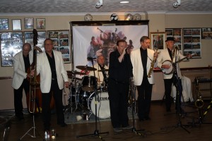 Tony Pitt's All Stars at Farnborough Jazz Club, High St, Farnborough, Kent, UK 29may2015, with Denny Ilett (trmpt), Al Nicols (rds), Dave Hewitt (trmb), Andy Lawrence (db), John Elmer (drms) and Tony (bnj). Photo by Mike Witt.29May2015