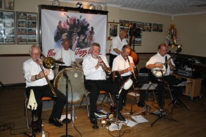 Golden Eagle Jazz Band at Farnborough Jazz Club on 17th July 2015. (LtoR) Roy Stokes (trombone), Pete Jackman (drums), Mike Scroxton (trumpet), Alan Cresswell (clarinet), Mike Broad (double bass) and Kevin Scott (tenor banjo). Photo by Mike Witt.