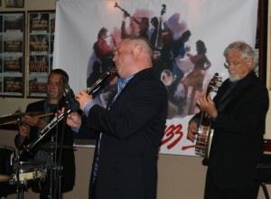 Julyan 'Baby Jools' Aldridge (drums) and Dave Moorwood (banjo) with band leader Matt Palmer (clarinet) with Millenium Eagle Jazz Band at Farnborough Jazz Club (Kent) on 24th July 2015. Photo by Mike Witt.