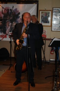 Band leader Matt Palmer playing clarinet (with just in view) Dave Moorwood on banjo with Millenium Eagle Jazz Band at Farnborough Jazz Club (Kent) on 24h July 2015. Photo by Mike Witt.