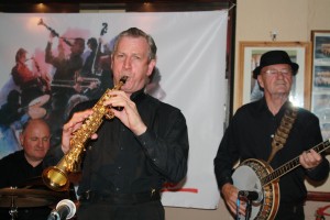 Tony Pit Pitt's All Stars (Tony-(banjo, Al Nicholls (soprano sax) and John Elmer (drums) at Farnborough JC, 14Aug2015. Photo by Mike Witt
