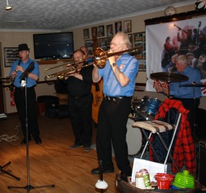 George 'Kid' Tidiman's All Stars at Farnborough Jazz Club on 18th September 2015. (LtoR) Tim Huskisson (cl), just hidden - John Sirett (d.bass), Denny Ilett (trmp), George 'Kid' Tidiman (trmb) and Bill Finch (drms), (also hidden - 'Southend Bob' Allbut (bnj). Photo by Mike Witt.