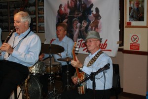 John Crocker (clarinet), Tony Pitt (banjo) and John Tyson (drums) - three of Barry Palser's Super Six at Farnborough Jazz Club, Kent on 11Sep2015. Photo by Mike Witt.