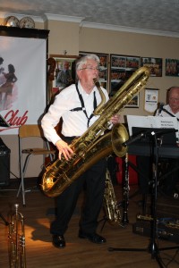 John Bayne on bass sax (big Bertha) with Bob Dwyer's Bix & Pieces at Farnborough Jazz Club on 29th January 2016. Photo by Mike Witt.