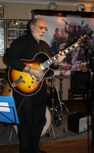 John Stuart is featired on banjo with Phoenix Dixieland Jazz Band at Farnborough Jazz Club on 22nd January 2016. Photo by Mike Witt.