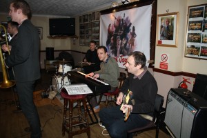 Martyn Bros @ Farnborough, Kent 15jan2016. The 'engine' (LtoR) Dom Coles on drums, Ian Beetlestone on piano and John 'Flashback Radio' Ruscoe. (up front) Allen Beechey on cornet and George Simmonds on trombone. Photo by Mike Witt.