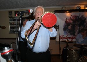Barry Palser on trombone seen here with his own band, 'Barry Palser's Super Six'  at Farnborough Jazz Club (Kent) on 12th February 2016. Behind him is Alan Morgan (double bass) & John Tyson (drums).  Photo by Mike Witt.