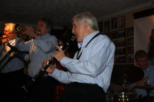 Cracking front line of Barry Palser's Super Six playing here at Farnborough Jazz Club (Kent) on 12th February 2016. (LtoR) Barry Palser (trombone), Allan 'Lord Arsenal' Bradley (trumpet), John Crocker (clarinet), plus John Tyson (drums). Photo by Mike Witt.