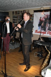 Jonny Boston plays clarinet on tour with 'Jonny Boston's Hot Jazz' at Farnborough Jazz Club, Kent, UK on 4th March 2016 (Gary Wood &Martin Guy on left). Photo by Mike Witt.