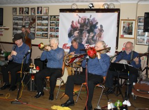 Mahogany Hall Stompers led by Brian Gyles (trumpet), with Tim Huskisson (clarinet), George 'Kid' Tidiman (trombone & vocals), Roger Curphey (d.bass), Chris Marchant (drums) and 'Southend Bob' Albutt (banjo & vocals). Photo by Mike Witt.