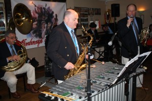 Leigh Henson sings and John Ellmer plays vibes with Mardi Gras JazzBand at Farnborough Jazz Club (Kent) on 19th February 2016. (LtoR) Marc Easener (sousaphone), John Ellmer (vibes), Tim Huskisson (piano), Rob Pearce (band leader) and Leigh Henson (trumpet). Photo by Mike Witt.