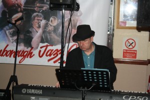 Tim Huskisson plays piano with 'Jonny Boston's Hot Jazz' band on tour at Farnborough Jazz Club, Kent, UK 4th March 2016. Photo by Mike Witt.