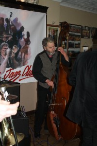 Roger Curphey (double bass) of Phoenix Dixieland Jazz Club plays a strong part of the 'engine' at Farnborough Jazz Club on 11th March 2016. Photo by Mike Witt.