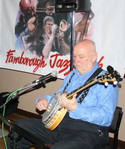 'Southend Bob' Allbut on banjo. One of George 'Kid' Tidiman's All Stars at Farnborough Jazz Club on 1st April 2016. Photo by Mike Witt.
