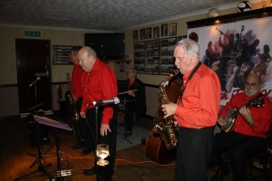 Mike Barry's Uptown Gang at Farnborough Jazz Club on 8th April 2016. (LtoR) 'Whispering MIke' Holt (tmb), Mike Barry (trp), Graham Collicotte (drms), Goff Dubber (alto sax), (hidden, Roger Curphey (d.bass), John Stewart (bnjo). Photo by Mike Witt.