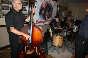 'Engine' of Dave Rance's Rockin' Chair Band at Farnborough Jazz Club (Kent) on Friday 10th June 2016. (LtoR) Mike Brewerton (d.bass), Henry Harrison (drums) and just visible - Doug Parry (banjo). Photo by Mike Witt.