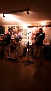 Mardi Gras JazzBand at Farnborough Jazz Club (Kent) on Friday 24th June 2016. (LtoR) John Ellmer (reeds & saxes), Leigh Henson (trumpet), Pete Smith sits in on drums (Monty Sunshine's drummer) and band leader Rob Pearce (trombone). Not pictured is Paul Higgs (piano) and Paul Baker (drums) Photo by Peter Marr.