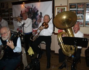 Yerba Buena Celebration Jazz Band at Farnborough Jazz Club (Kent) on 3rd June 2016. (LtoR) Nick Singer (banjo &vocals), Pete Lay (drums), Dave Rance (1st trumpet&vocals), George 'Kid' Tidiman (trombone), and John Arthy (tuba). Photo by Mike Witt.