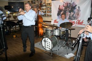 'Barry Palser's Super Six' playing at Farnborough Jazz Club (Kent) on 15th July 2016. (LtoR) Gary Wood (trumpet), Andy Lawrence (double bass), John Tyson (drums) and just out of view -Tony Pitt (banjo), Goff Dubber (clarinet) and Barry Palser (trombone). Photo by Mike Witt.