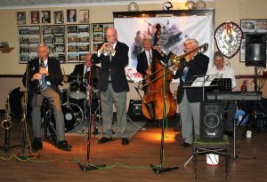 Jackie Free's Chicagoans play for Farnborough Jazz Club (Kent) on Friday, 5th August 2016. (LtoR) John Crocker (clarinet &alto sax), Martin Guy (drums), Mike Cotton (trumpet), Murray Salmon (double bass), Jackie Free (trombone & euphonium) and Tim Husskison (piano). Photo by Mike Witt.