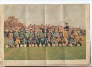 A photo of some 50+ youngsters, who attended sports fields at Midfield School in St. Pauls Cray, taken in 1992. Each received some five hours intensive training from England's top professional goalkeepers. Peter Abbott, who was England's Disabled goalkeeper, was one. Other England professionals included Nigel Martyn and Eire's International manager Theo Folley, (passing on their goalkeeping skills. with the idea of cultivating more British goalkeepers for the future). Newspaper story taken from Peter King of Chrystal Palace News in 1992.