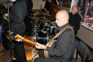 Tony Pitt plays banjo with his own 'Tony Pitt's All Stars and John Ellmer on drums, They were here at Farnborough Jazz Club for Keith's birthday on 12th August 2016. Photo by Mike Witt.